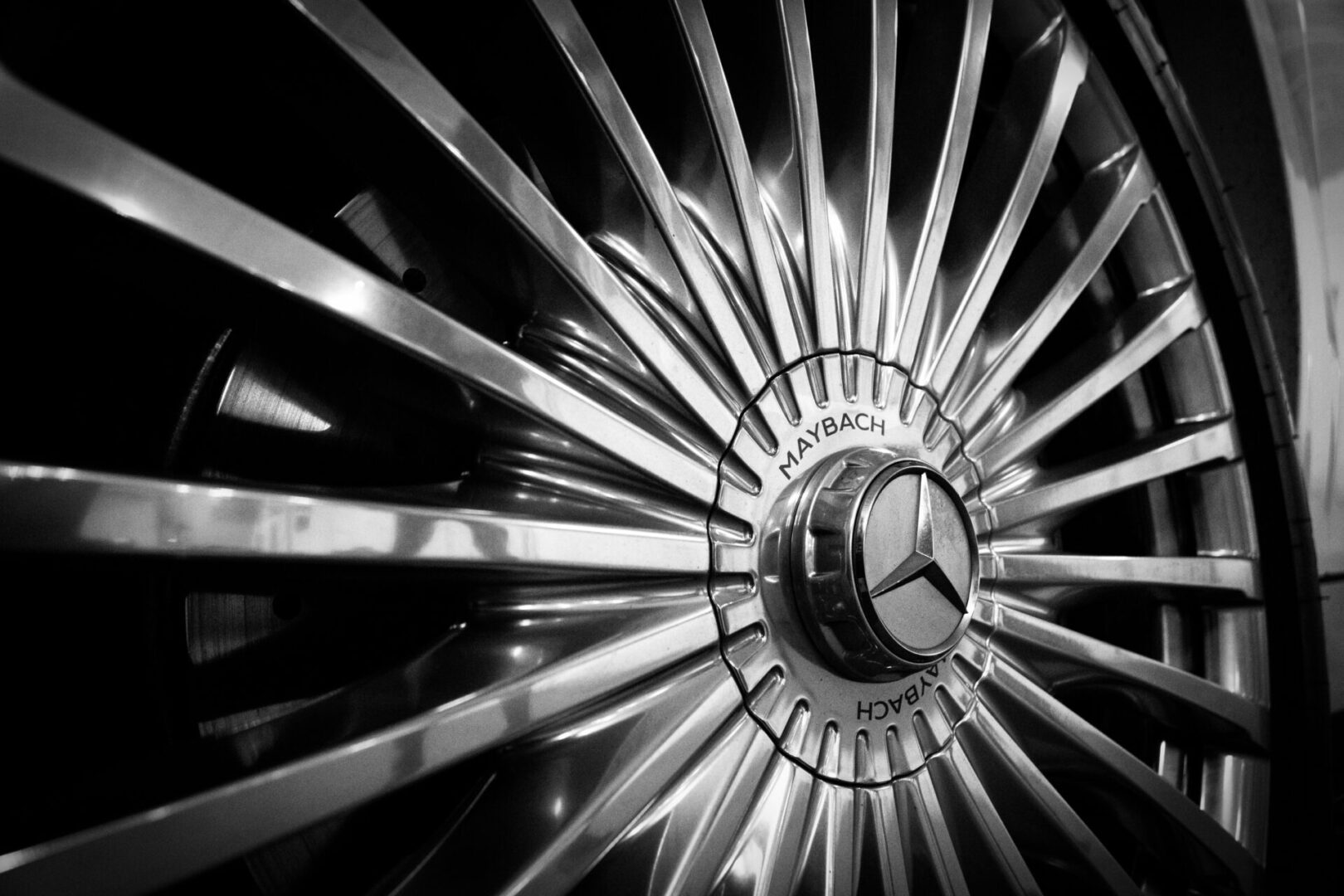 A close up of the wheel of an old mercedes.