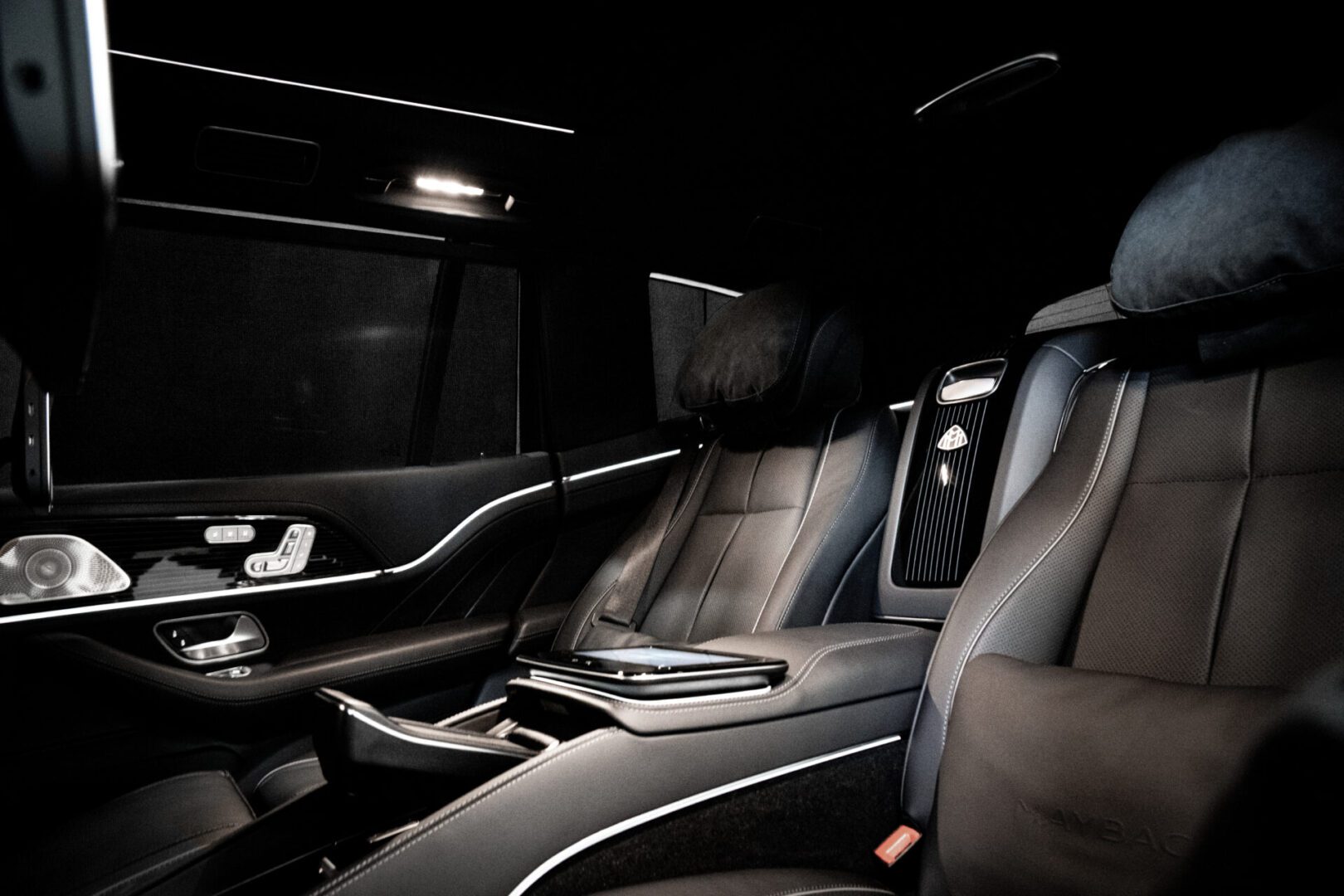 A car with black leather seats and a white trim.