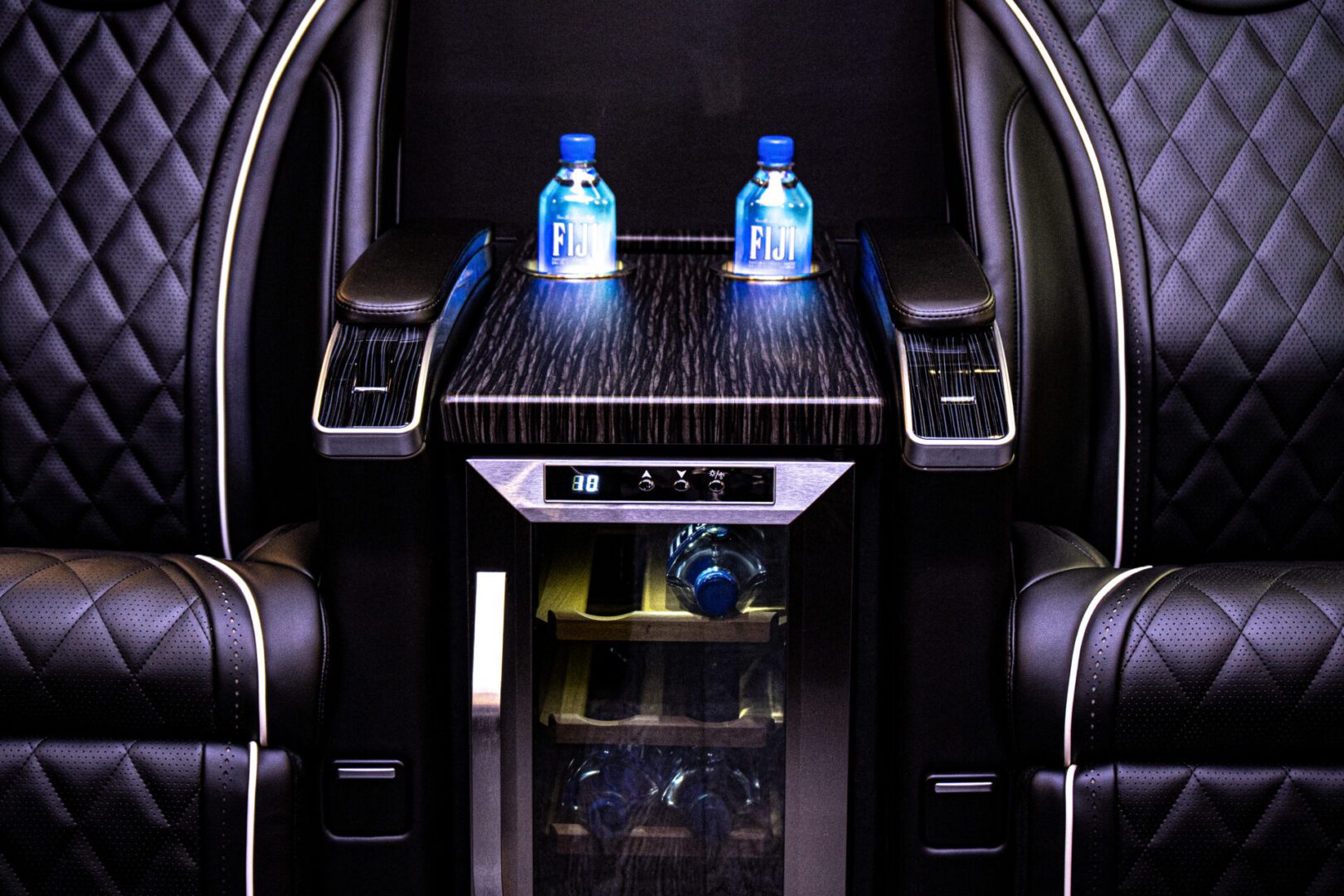A tray with two bottles of water on it.