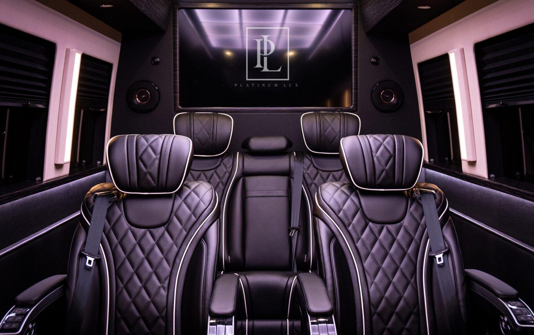 A view of the back seats in a limo.