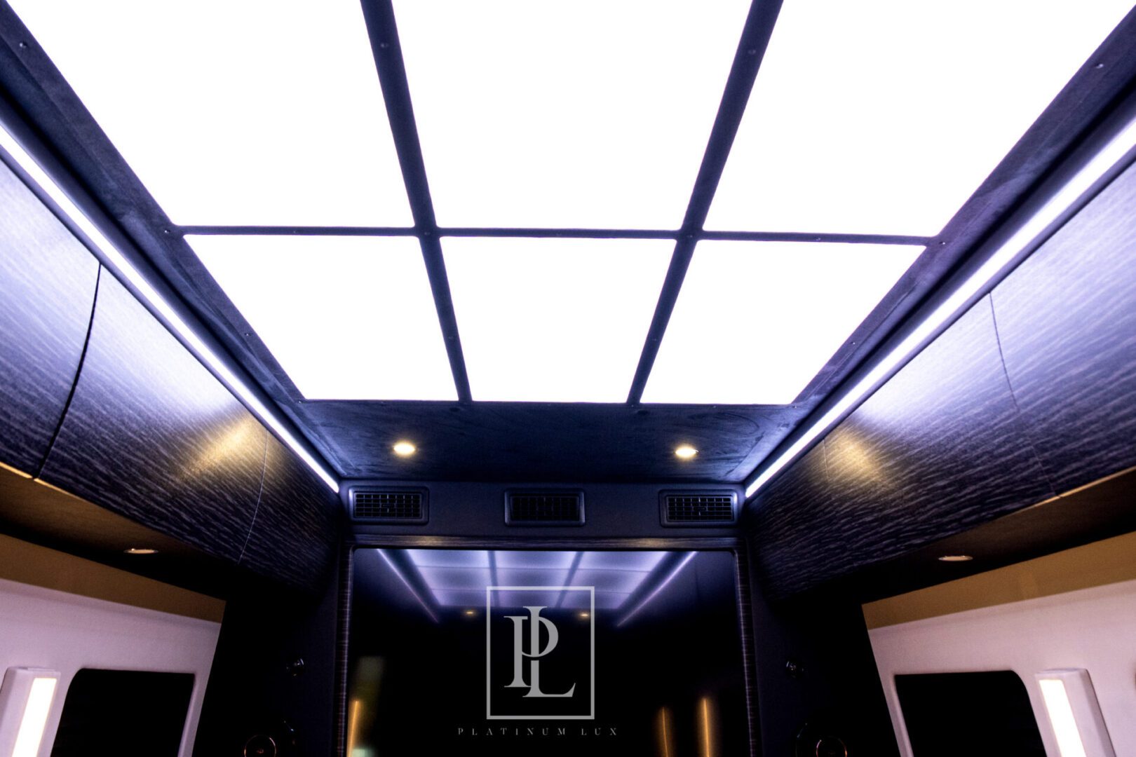A view of the inside of a building with a light fixture.